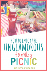 hot dogs, vegetables, and buns on a red checkered table cloth, text reads how to enjoy the unglamorous family picnic
