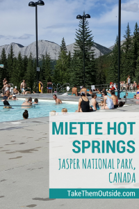 tourists enjoying the public pools at Miette Hot Springs in Jasper National Park, Canada