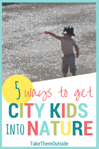 toddler wearing shorts and a sun hat playing in a concrete city splash park. text reads 5 ways to get city kids into nature.