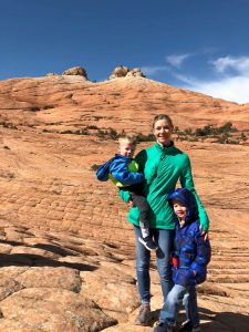 mom and 2 kids in Utah with red rocks in the background