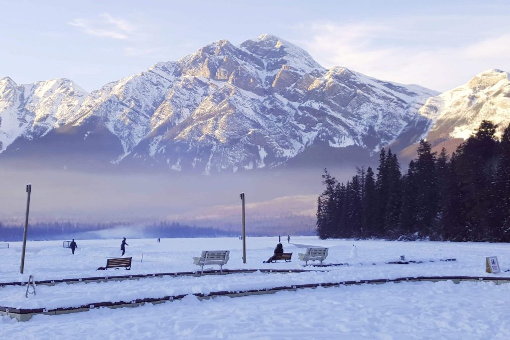 outdoor ice skating on the frozen lake at Pyramid Lake in Jasper National Park