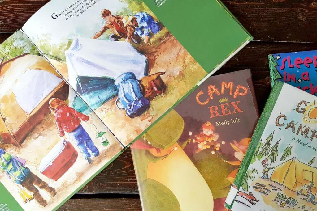 a pile of kids books about camping
