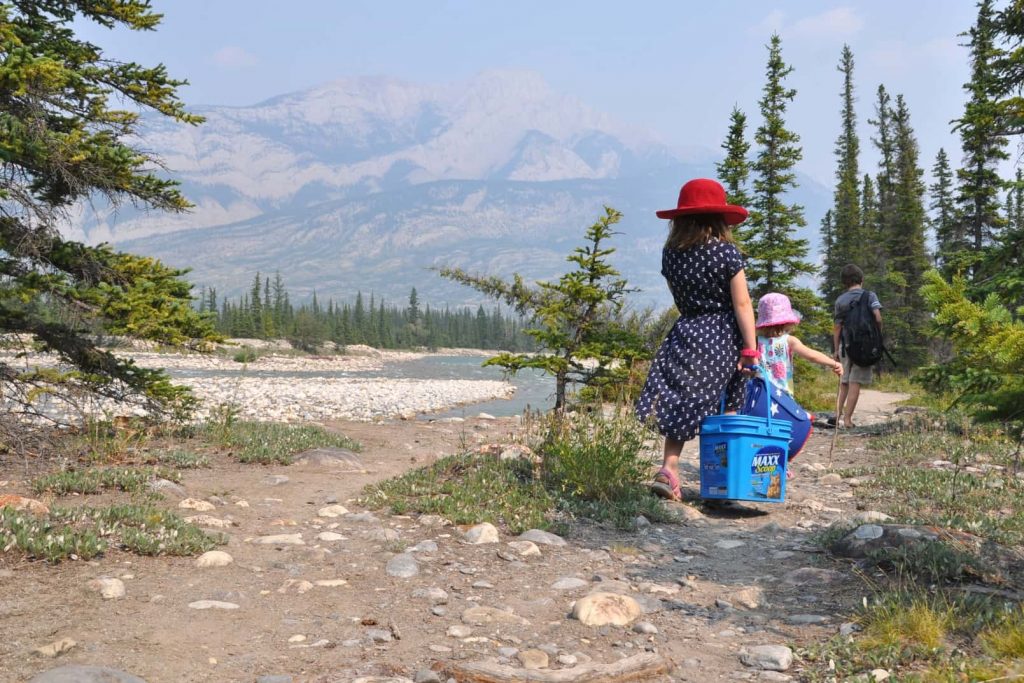 Children walking along the river path at Snaring Campground in Jasper National Park