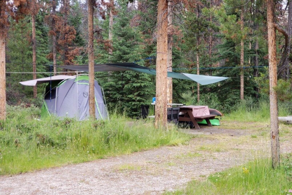 Large tarps hung over the campsite to help the tent and eating area stay dry