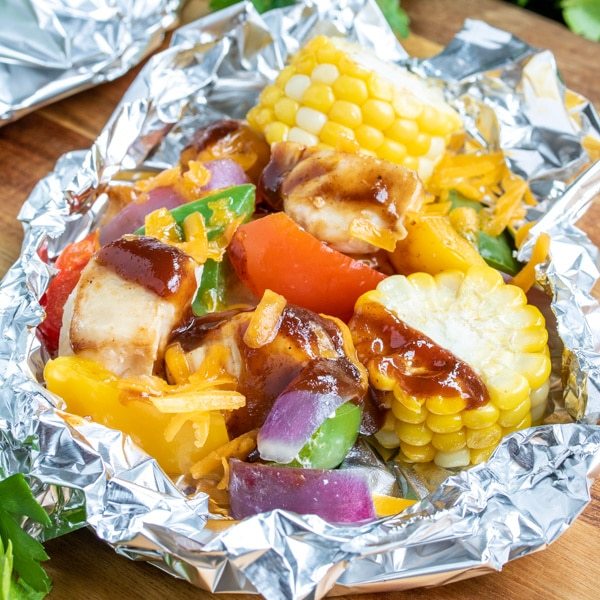 chicken, corn, and vegetables in a foil packet