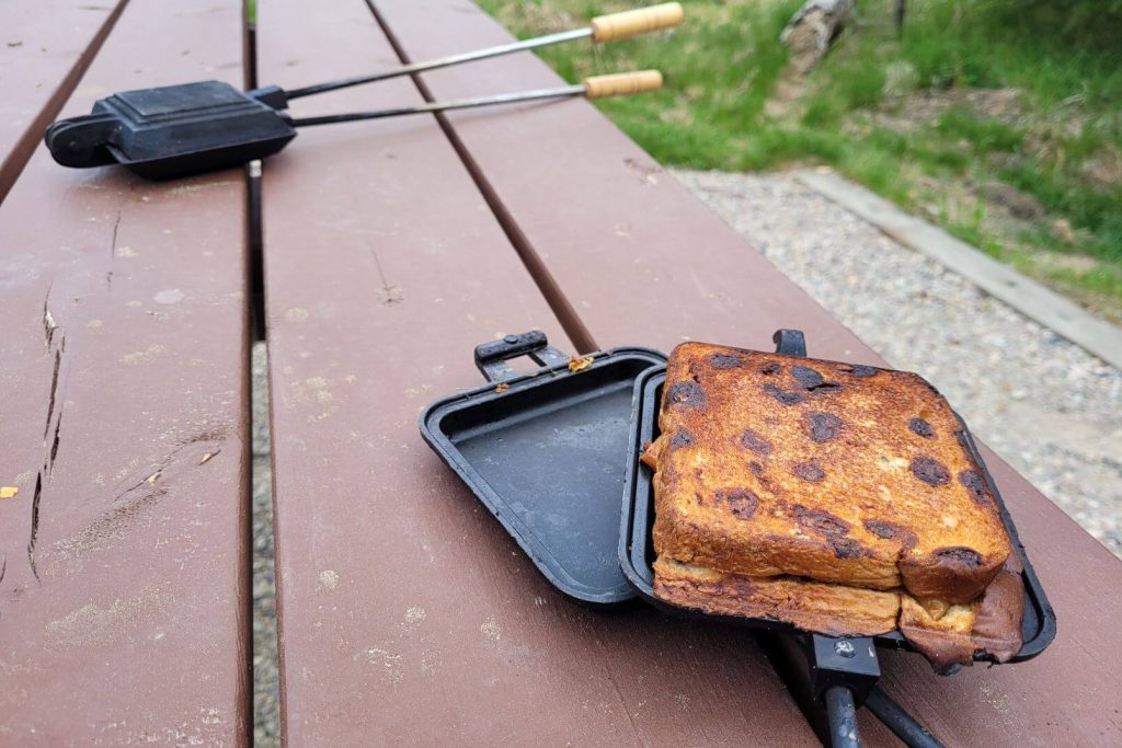 a cooked apple pie using the campfire pie iron