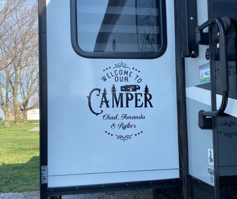 a personalized custom made decal on a camper door