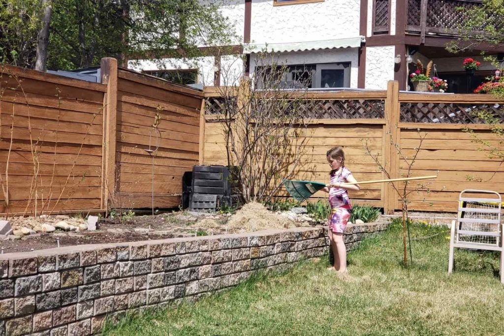 one child doing gardening in the backyard