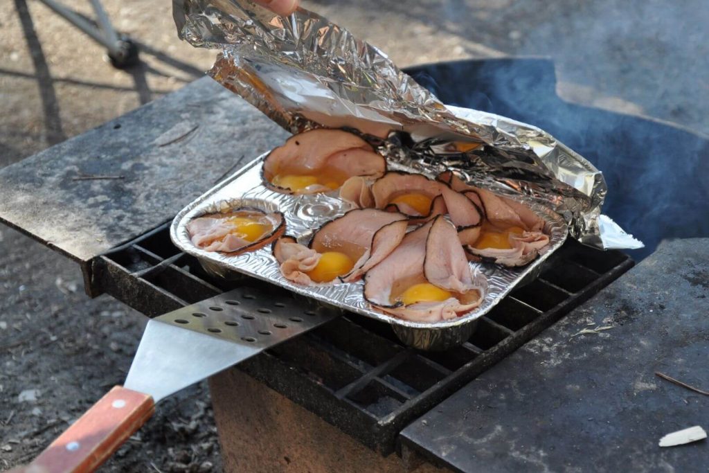 https://www.takethemoutside.com/wp-content/uploads/2022/03/cooking-camping-eggs-over-the-campfire-1024x683.jpg