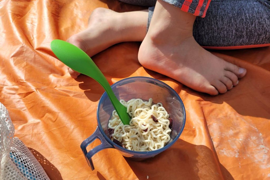 a camping cup of ramen noodles for dinner